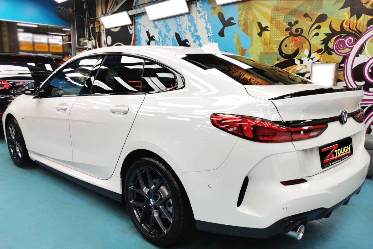Rear quarter of the BMW M235i, glossy and protected.