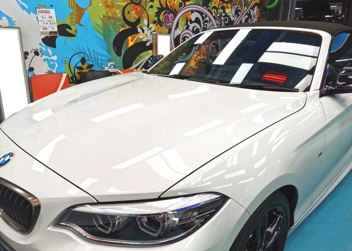 The BMW M240i from a side angle after the ceramic coating.