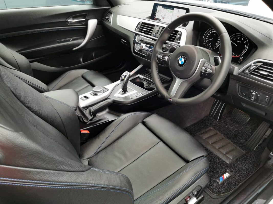 The BMW M240i parked in the workshop, freshly coated.