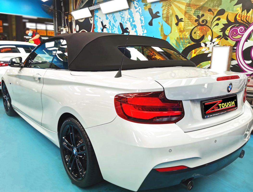 Rear quarter of the BMW M240i, glossy and protected.