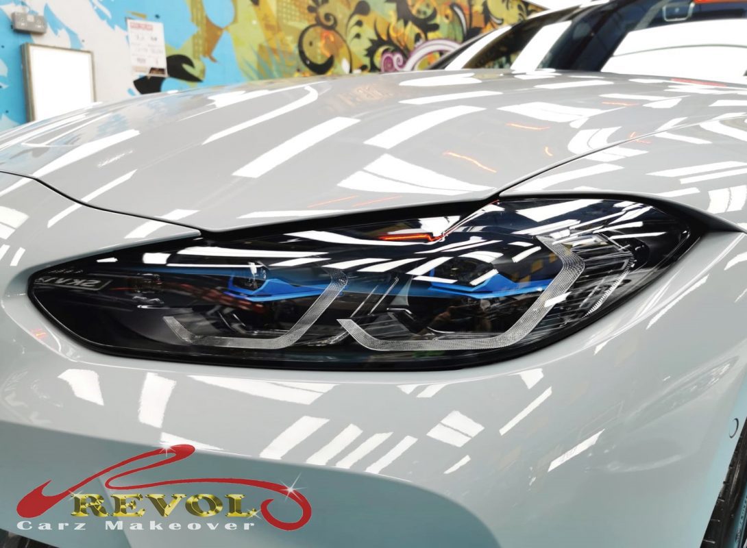 The M3's coated paintwork showing clean reflections.