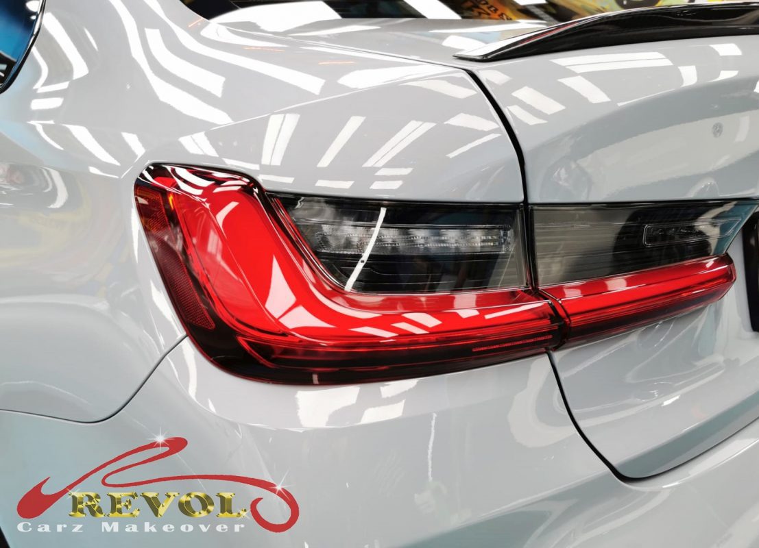 The coated bonnet of the M3 under workshop lighting.