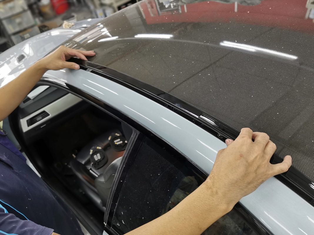 Polishing the new paint on the M3 to bring up the shine.