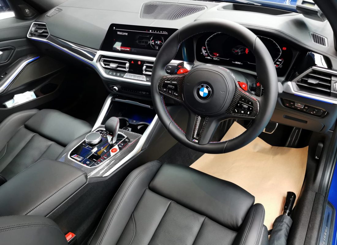 The BMW M3 parked in the workshop, freshly coated.
