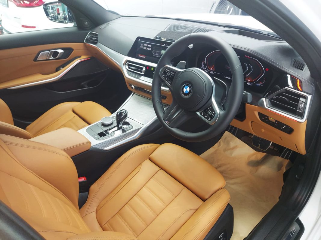 The M340i parked in the workshop, freshly coated.