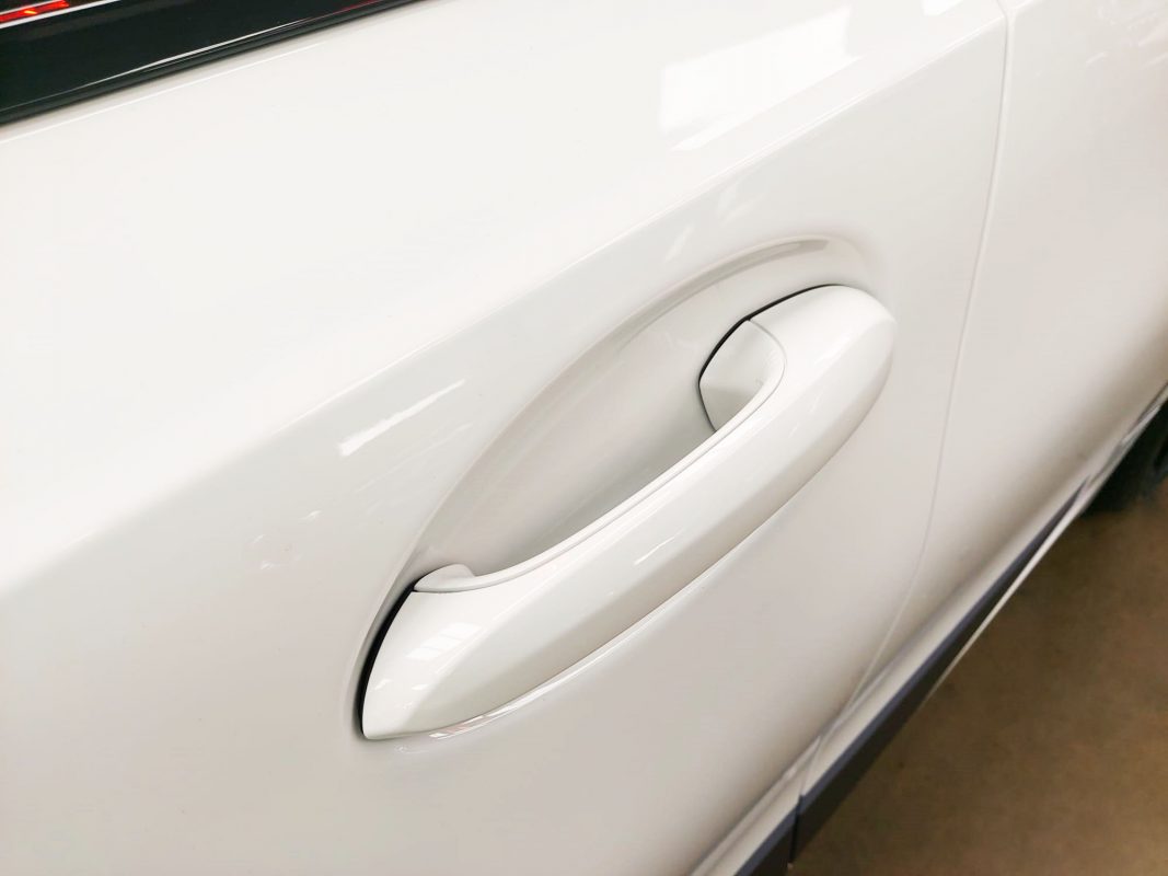 Rear quarter of the M340i, glossy and protected.