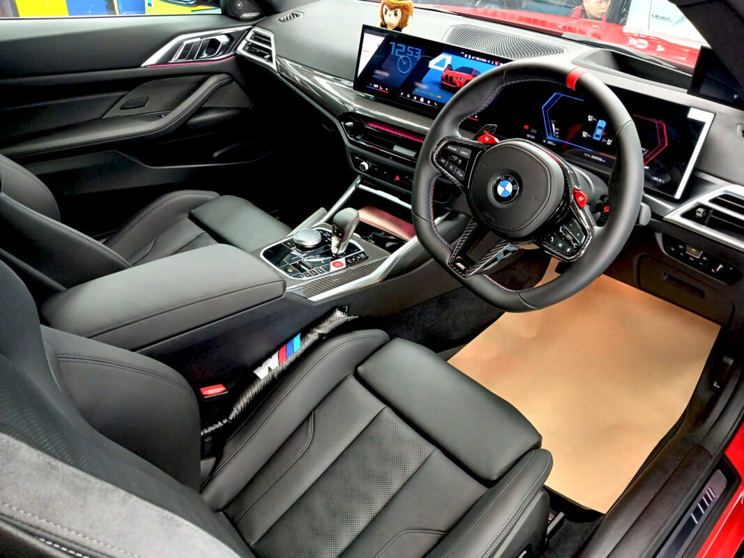 The BMW M4 parked in the workshop, freshly coated.