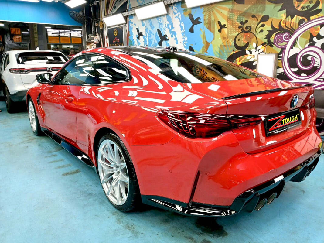 Rear quarter of the BMW M4, glossy and protected.