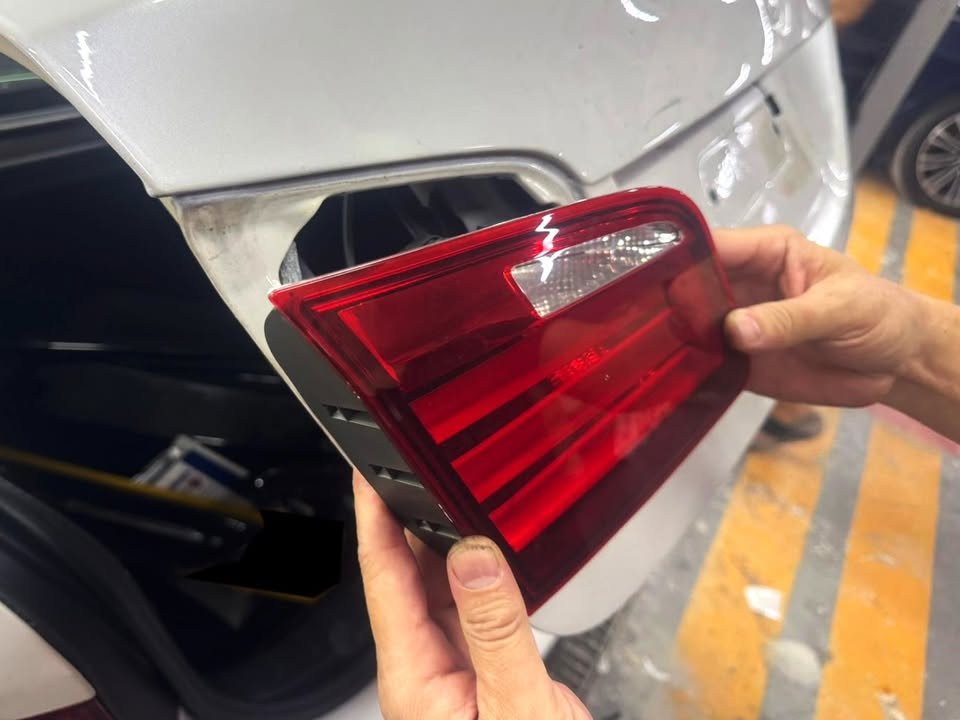 Tail lamp held up after removal from the M5's boot lid.