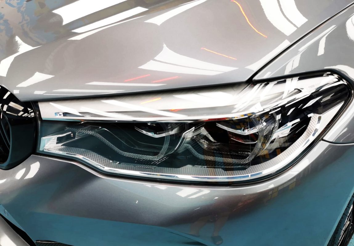 The M5's coated paintwork showing clean reflections.