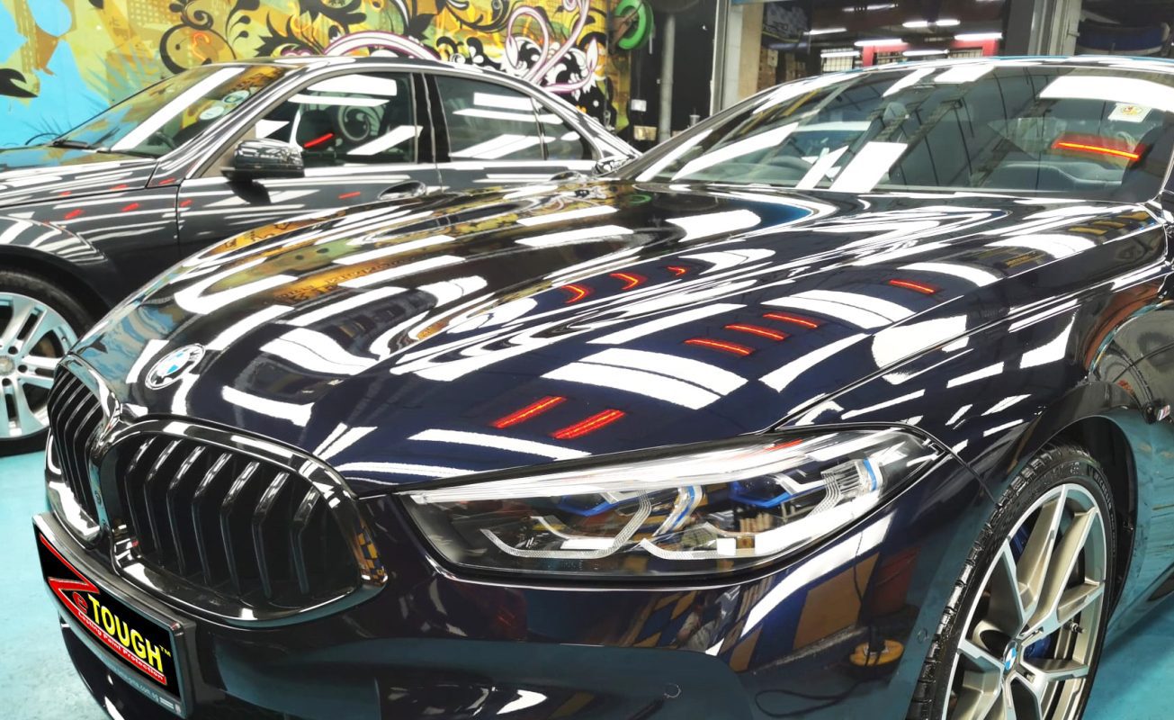 The BMW M850i from a side angle after the ceramic coating.
