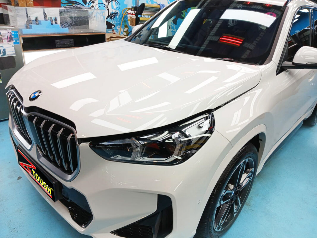 The BMW X1 from a side angle after the ceramic coating.