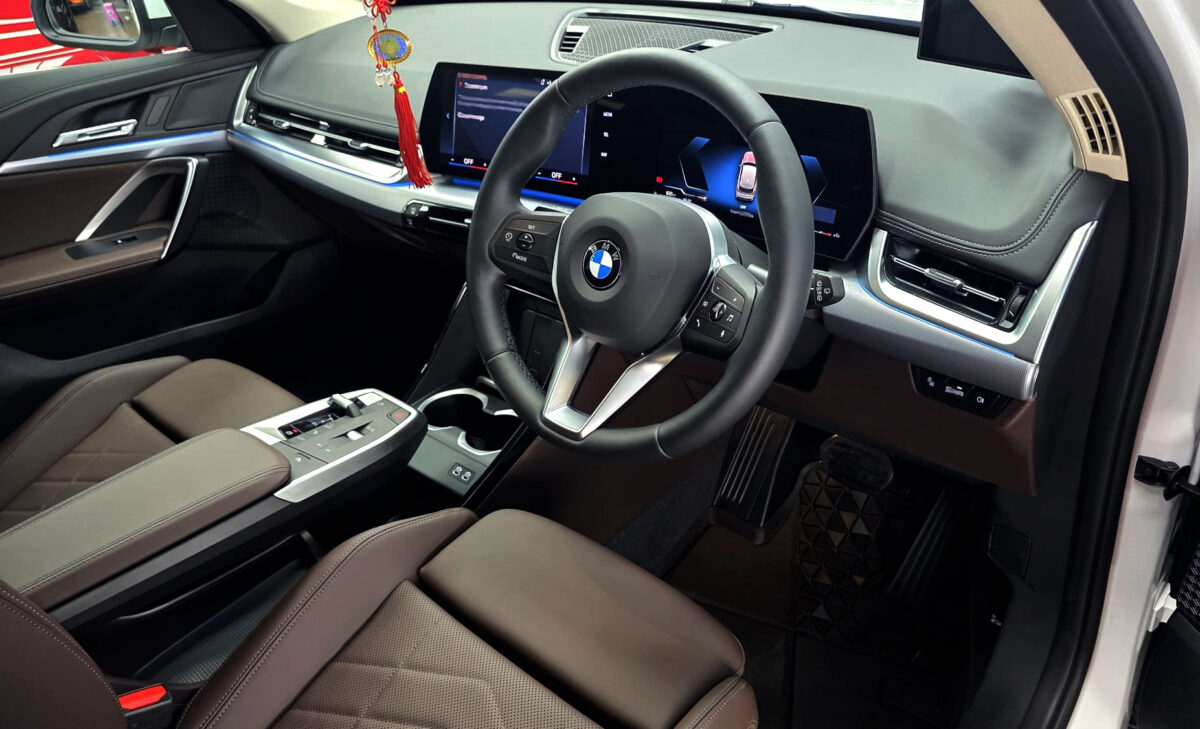 The BMW X1 parked in the workshop, freshly coated.