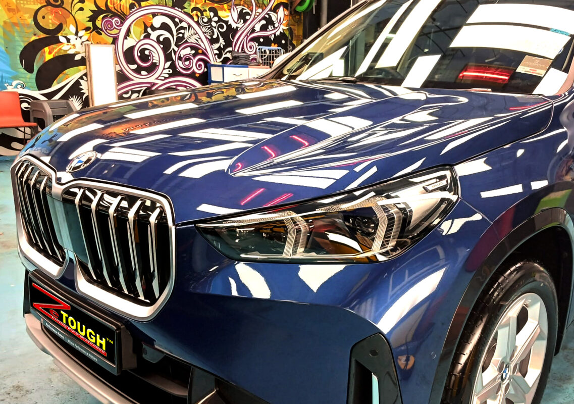 The BMW X1 from a side angle after the ceramic coating.