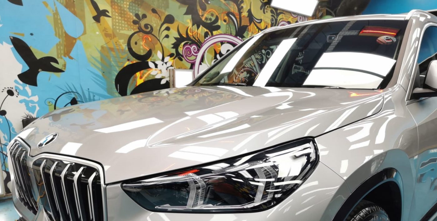 The BMW X1 from a side angle after the ceramic coating.