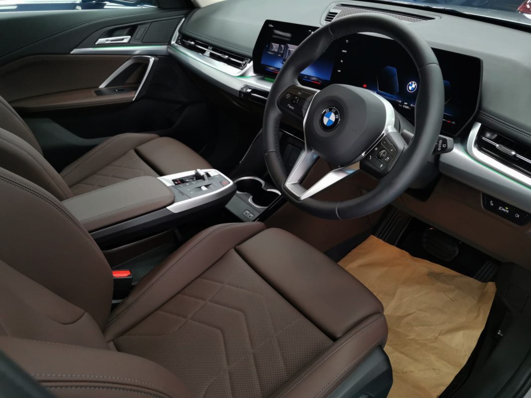 The BMW X1 parked in the workshop, freshly coated.