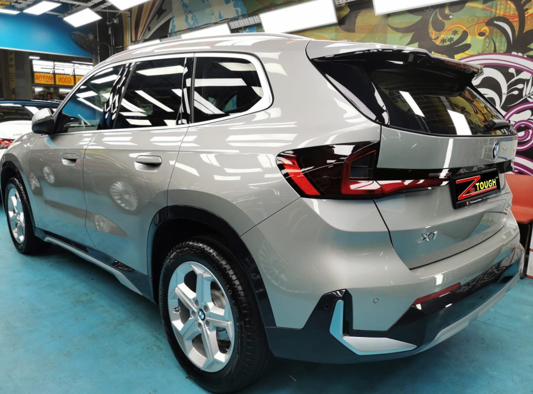 Rear quarter of the BMW X1, glossy and protected.