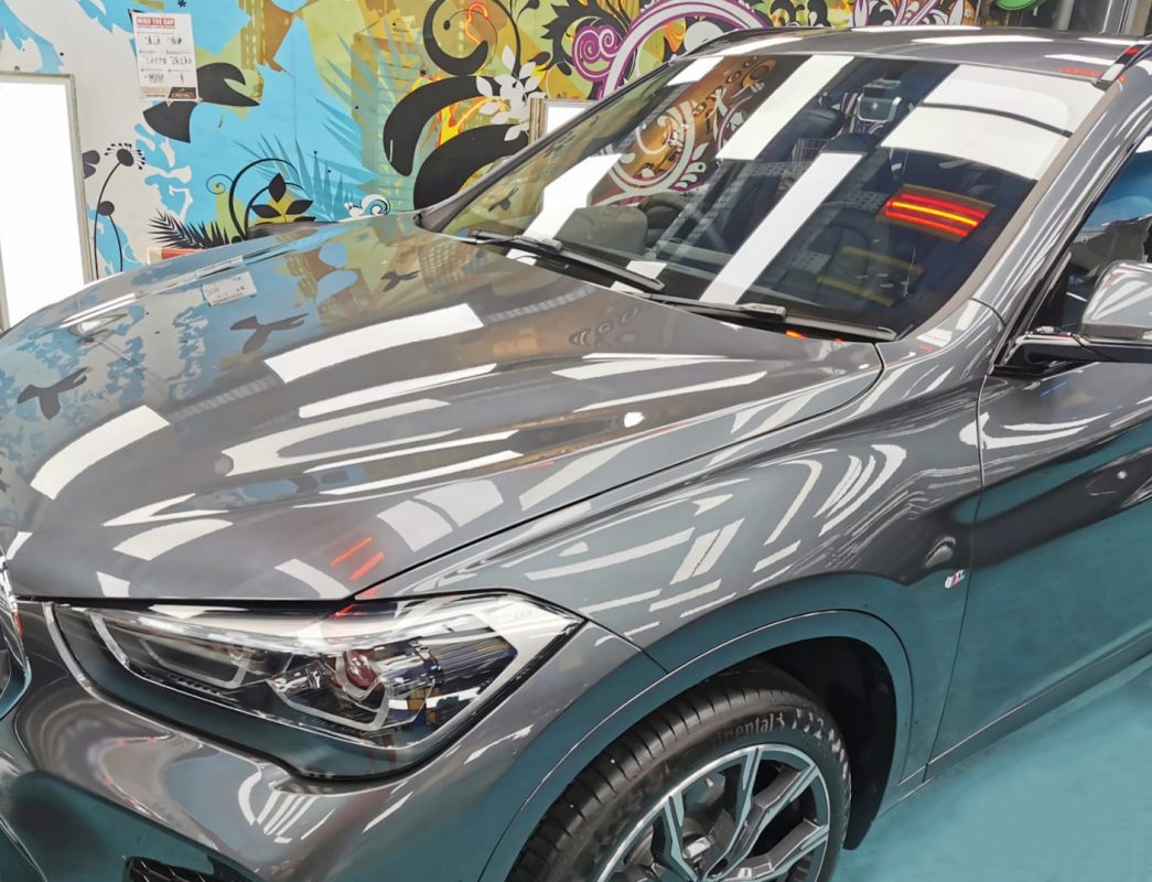 The BMW X1 from a side angle after the ceramic coating.