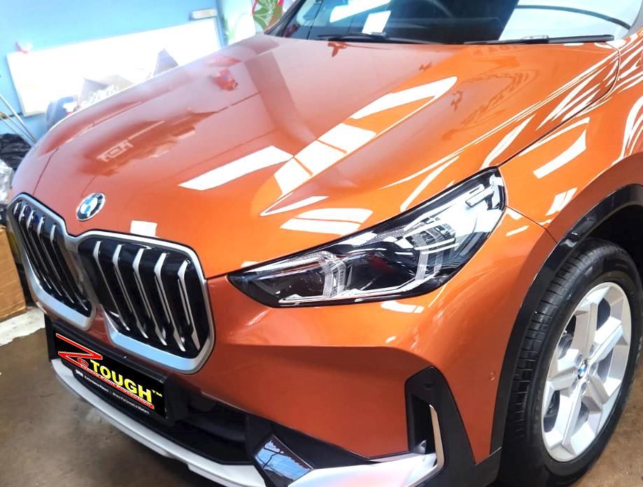The BMW X1 from a side angle after the ceramic coating.