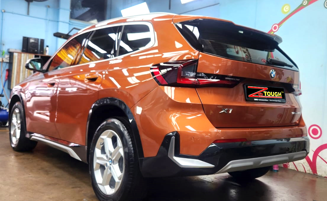 Rear quarter of the BMW X1, glossy and protected.