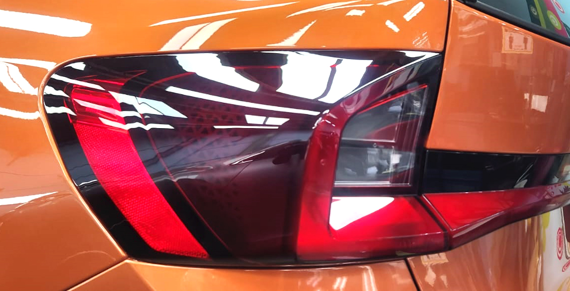 The coated bonnet of the BMW X1 under workshop lighting.