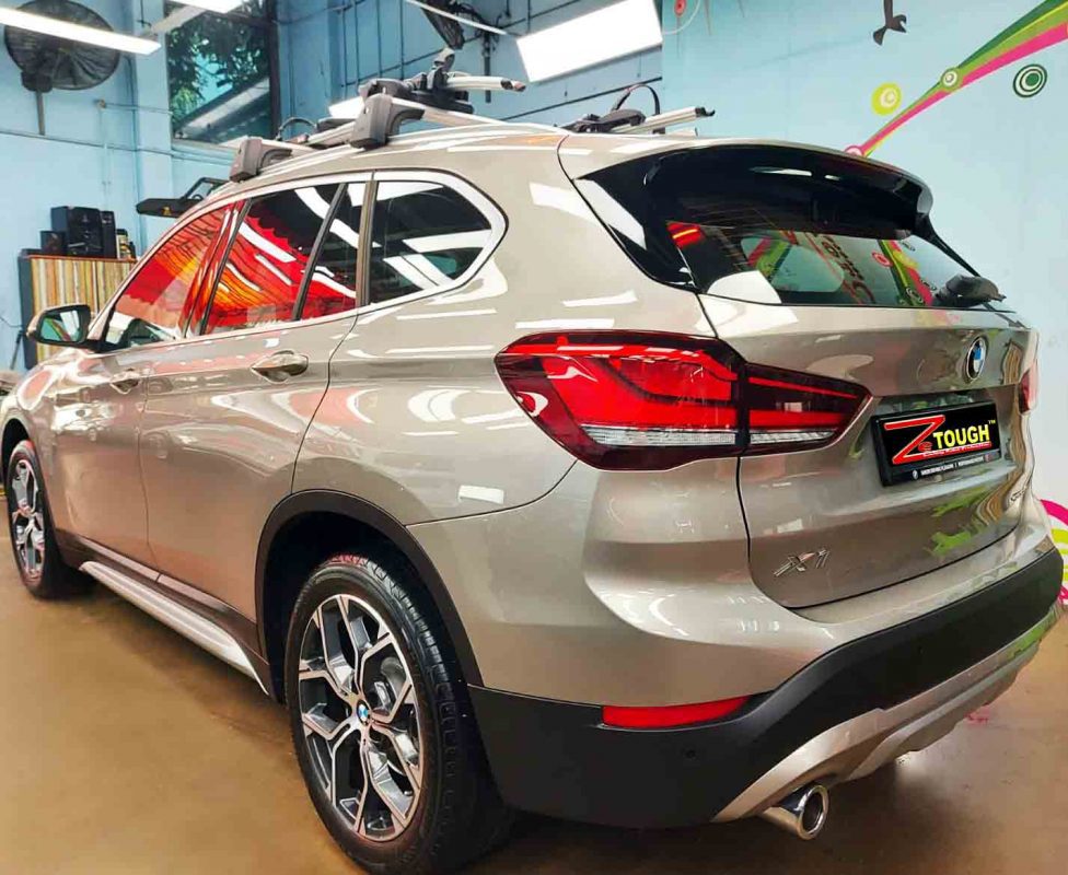 Rear quarter of the BMW X1, glossy and protected.