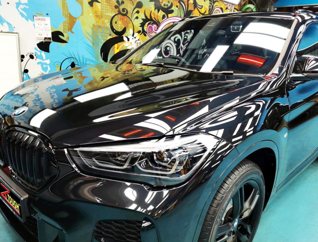 The BMW X1 from a side angle after the titanium coating.