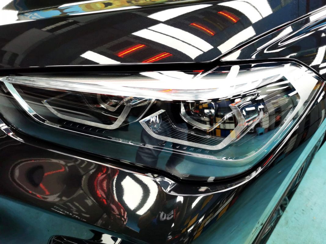 The X1's coated paintwork showing clean reflections.