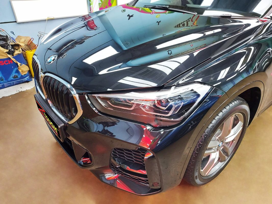 The BMW X1 from a side angle after the titanium coating.