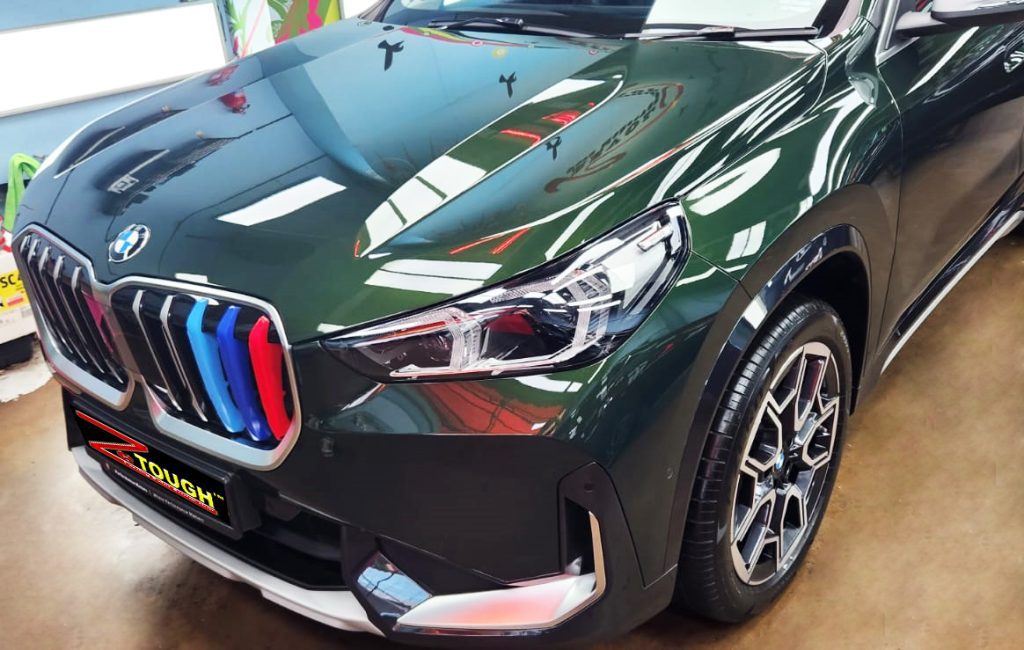 The BMW X1 from a side angle after the ceramic coating.
