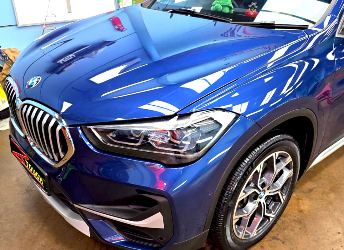 The BMW X1 from a side angle after the ceramic coating.