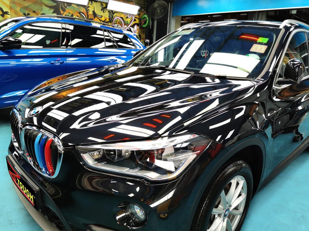 The BMW X1 from a side angle after the ceramic coating.
