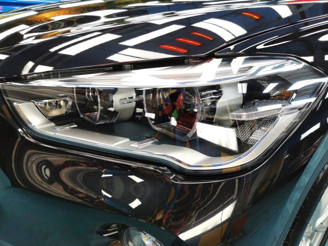 The X1's coated paintwork showing clean reflections.