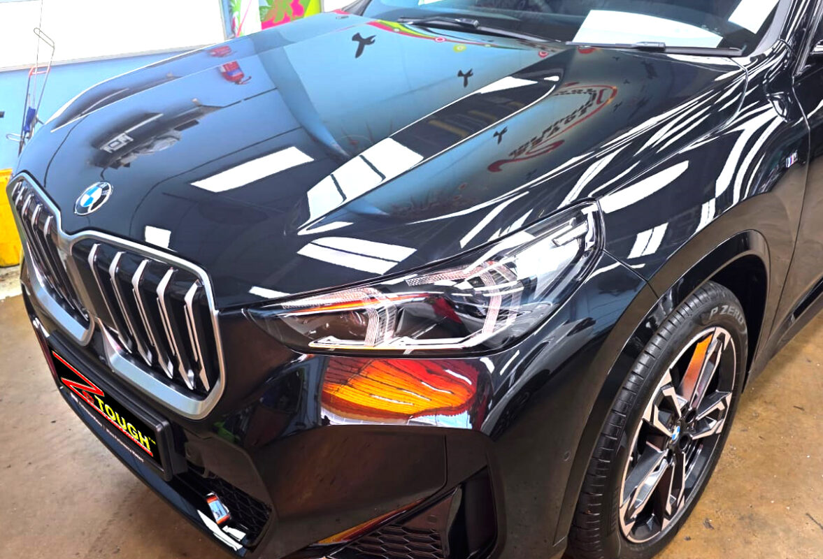 The BMW X1 from a side angle after the titanium coating.