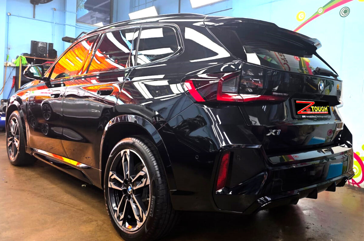 Rear quarter of the BMW X1, glossy and protected.