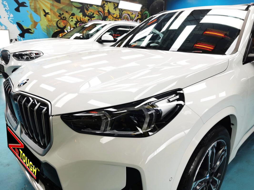 The BMW X1 from a side angle after the ceramic coating.
