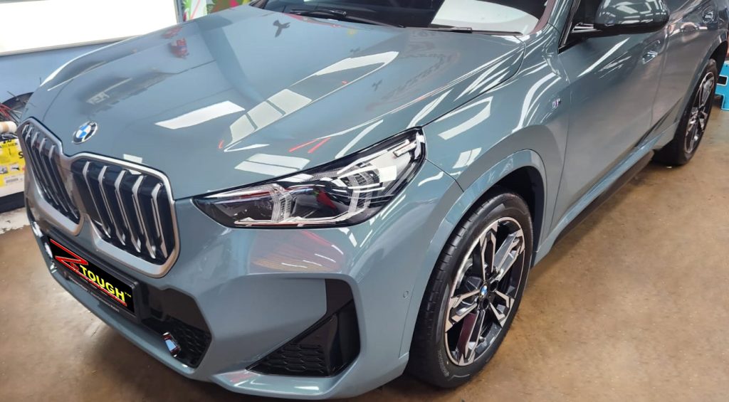 The BMW X1 from a side angle after the ceramic coating.