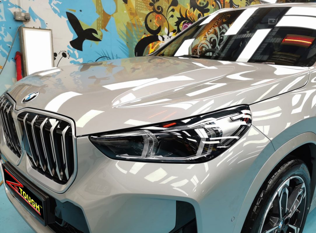 The BMW X1 from a side angle after the ceramic coating.