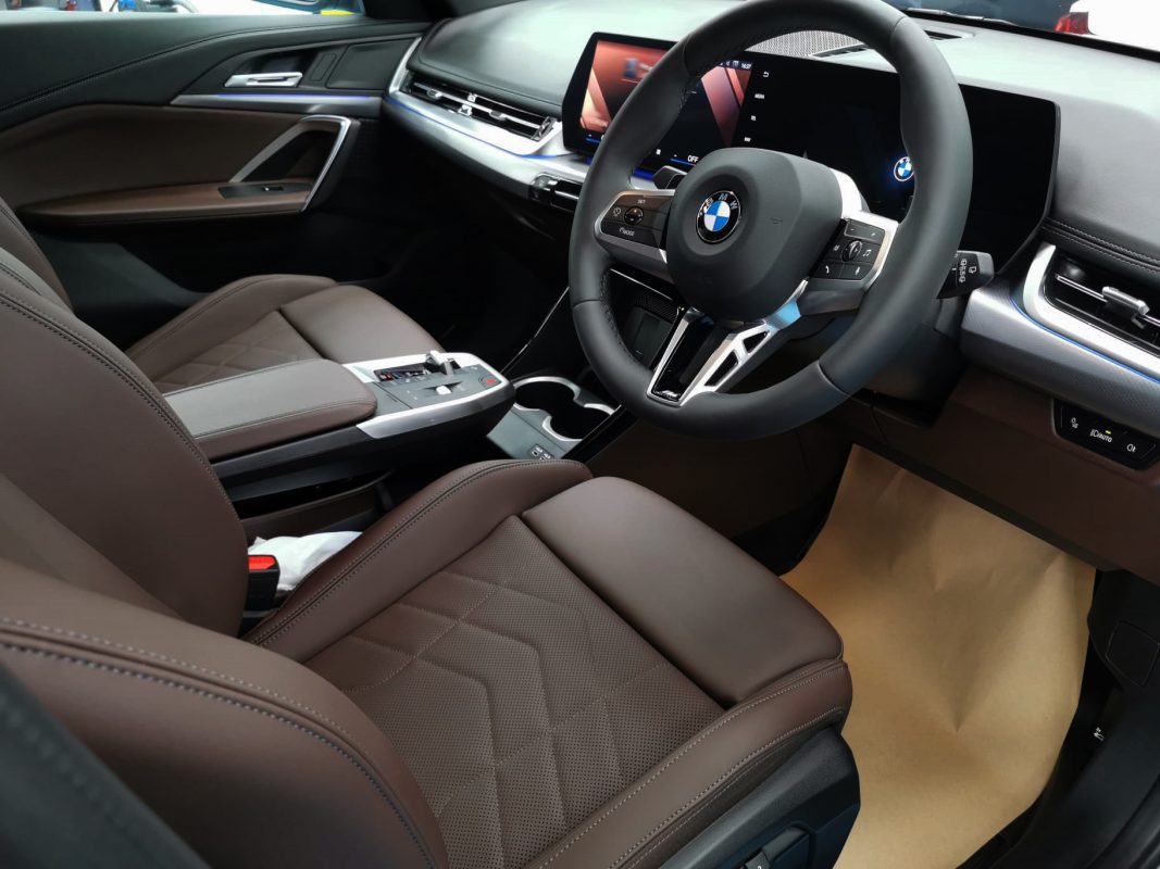 The BMW X1 parked in the workshop, freshly coated.