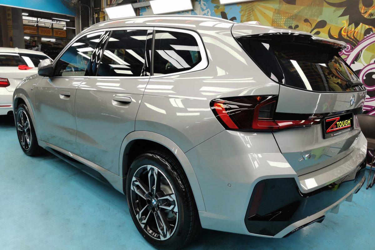 Rear quarter of the BMW X1, glossy and protected.
