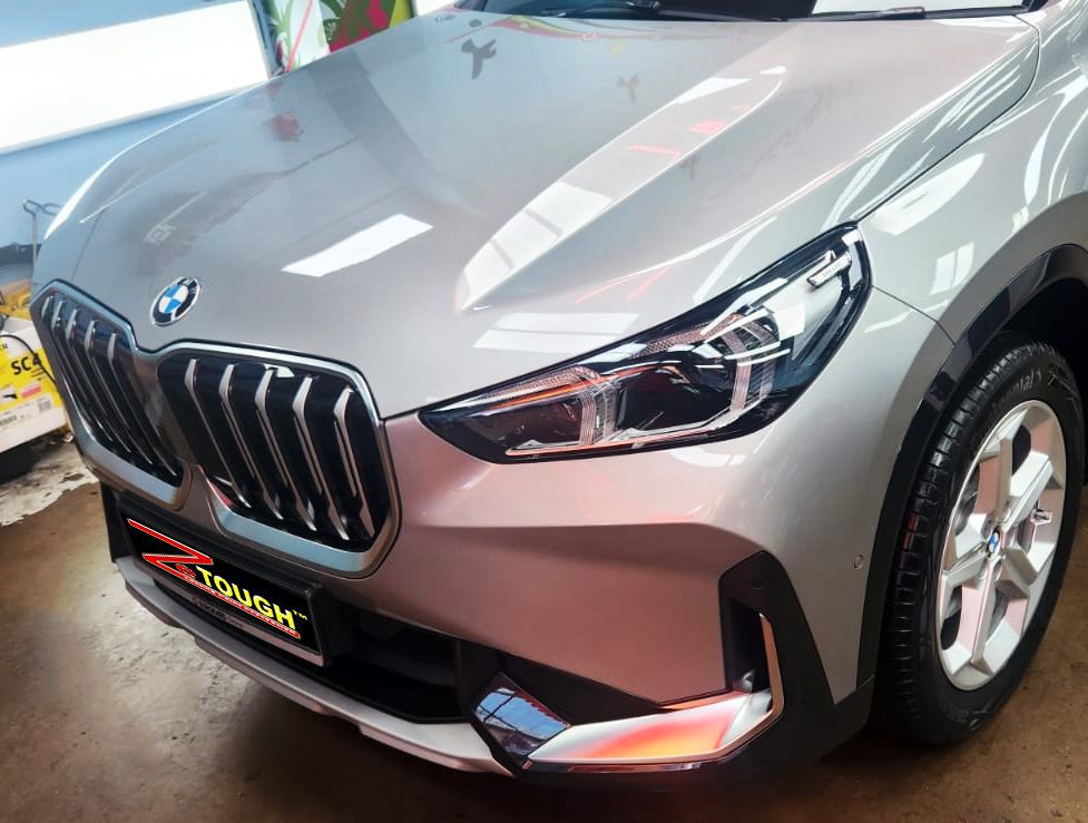 The BMW X1 from a side angle after the titanium coating.