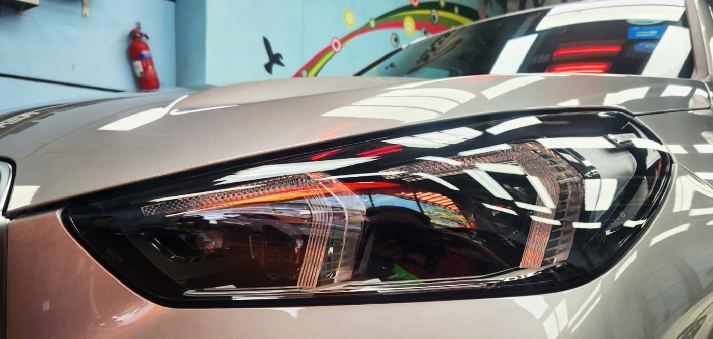 The X1's coated paintwork showing clean reflections.