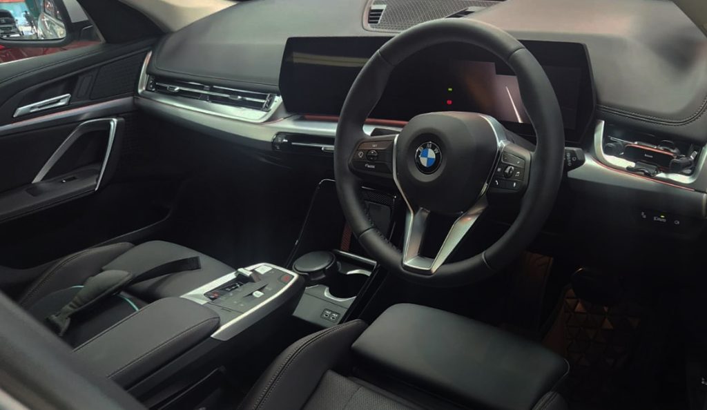 The BMW X1 parked in the workshop, freshly coated.