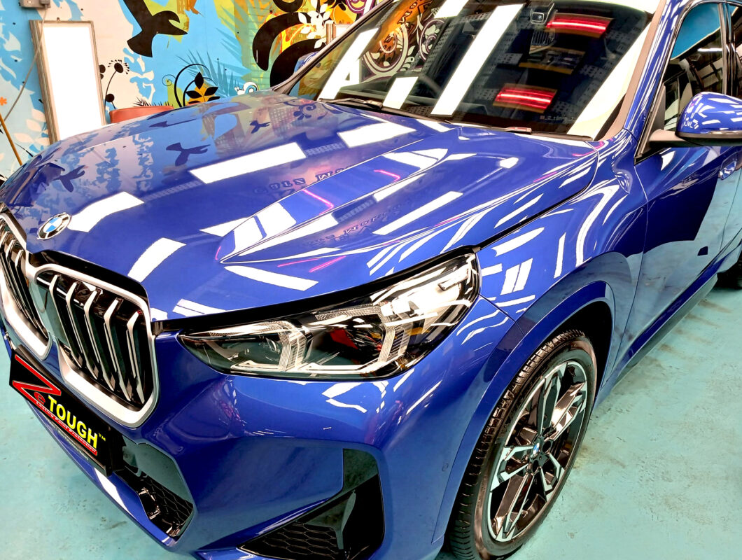 The BMW X1 from a side angle after the titanium coating.