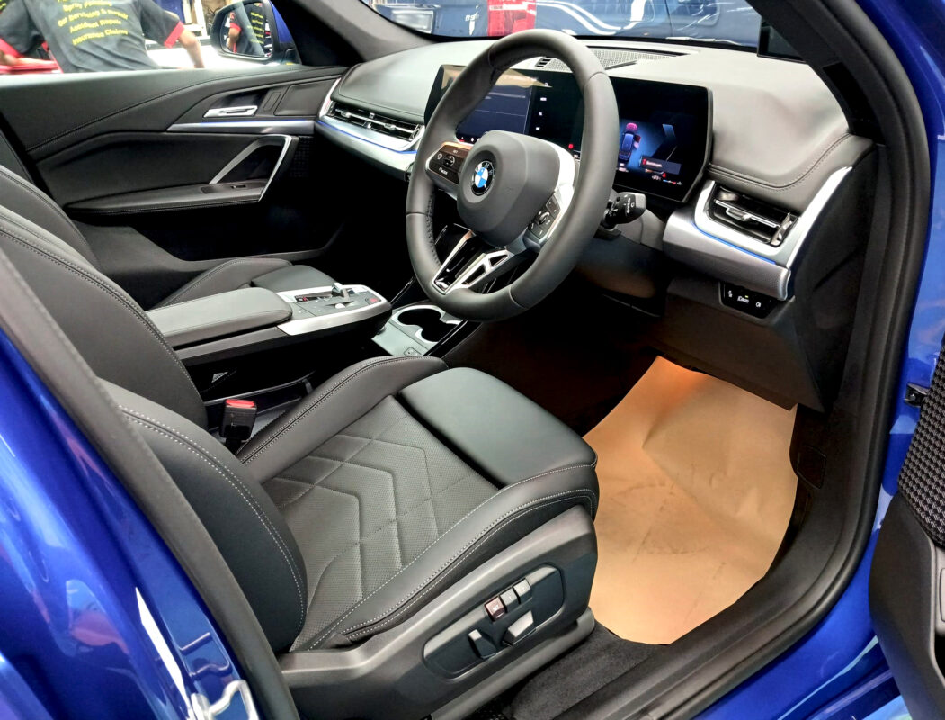The BMW X1 parked in the workshop, freshly coated.
