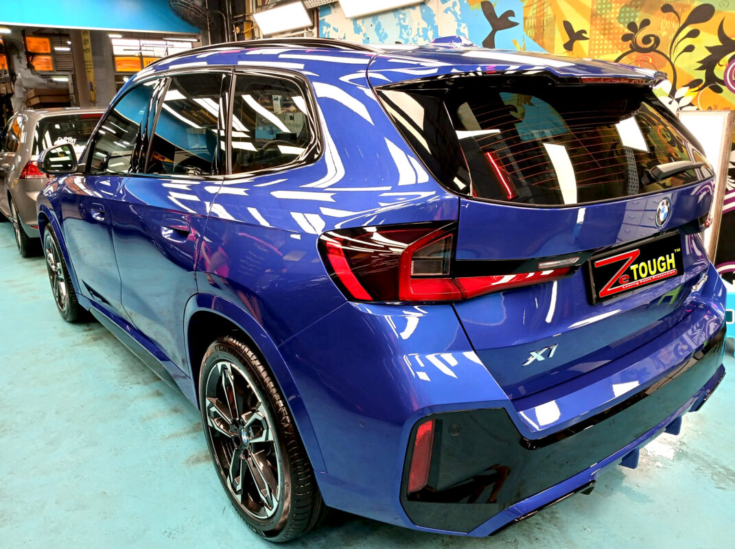 Rear quarter of the BMW X1, glossy and protected.