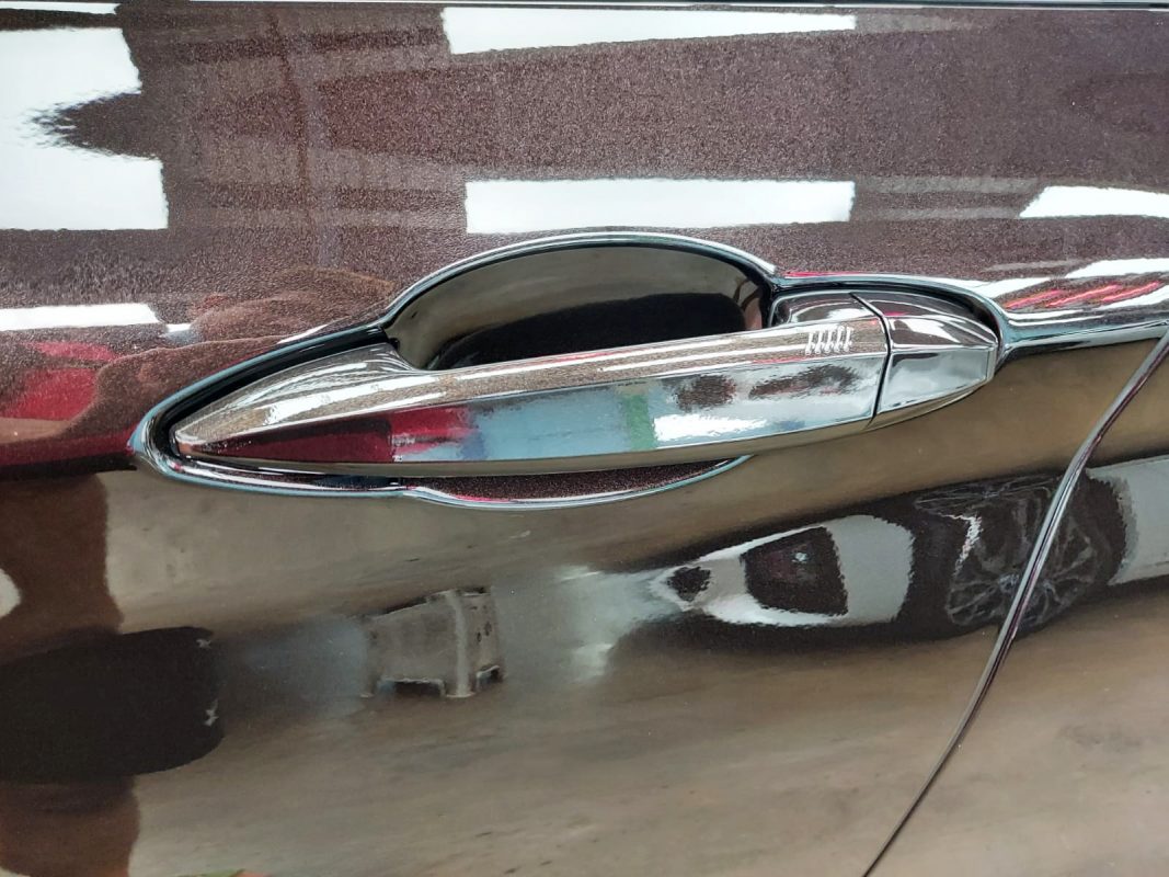 Rear quarter of the X1, glossy and protected.