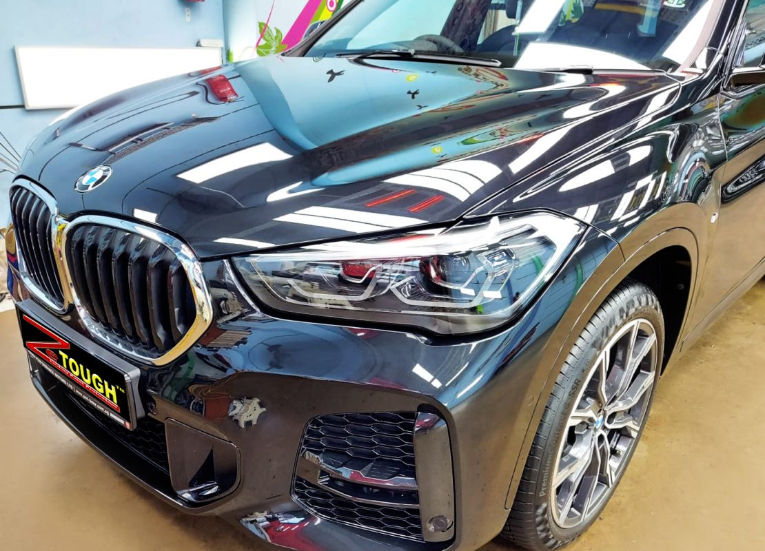 The BMW X1 from a side angle after the ceramic coating.