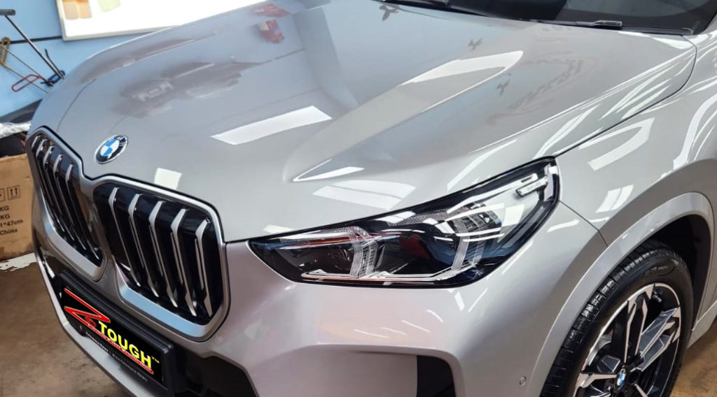 The BMW X1 from a side angle after the ceramic coating.
