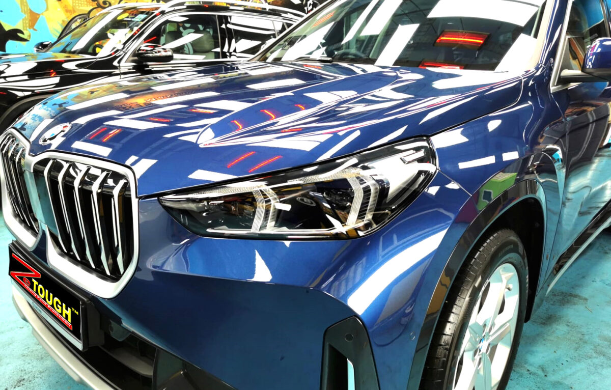 The BMW X1 from a side angle after the titanium coating.